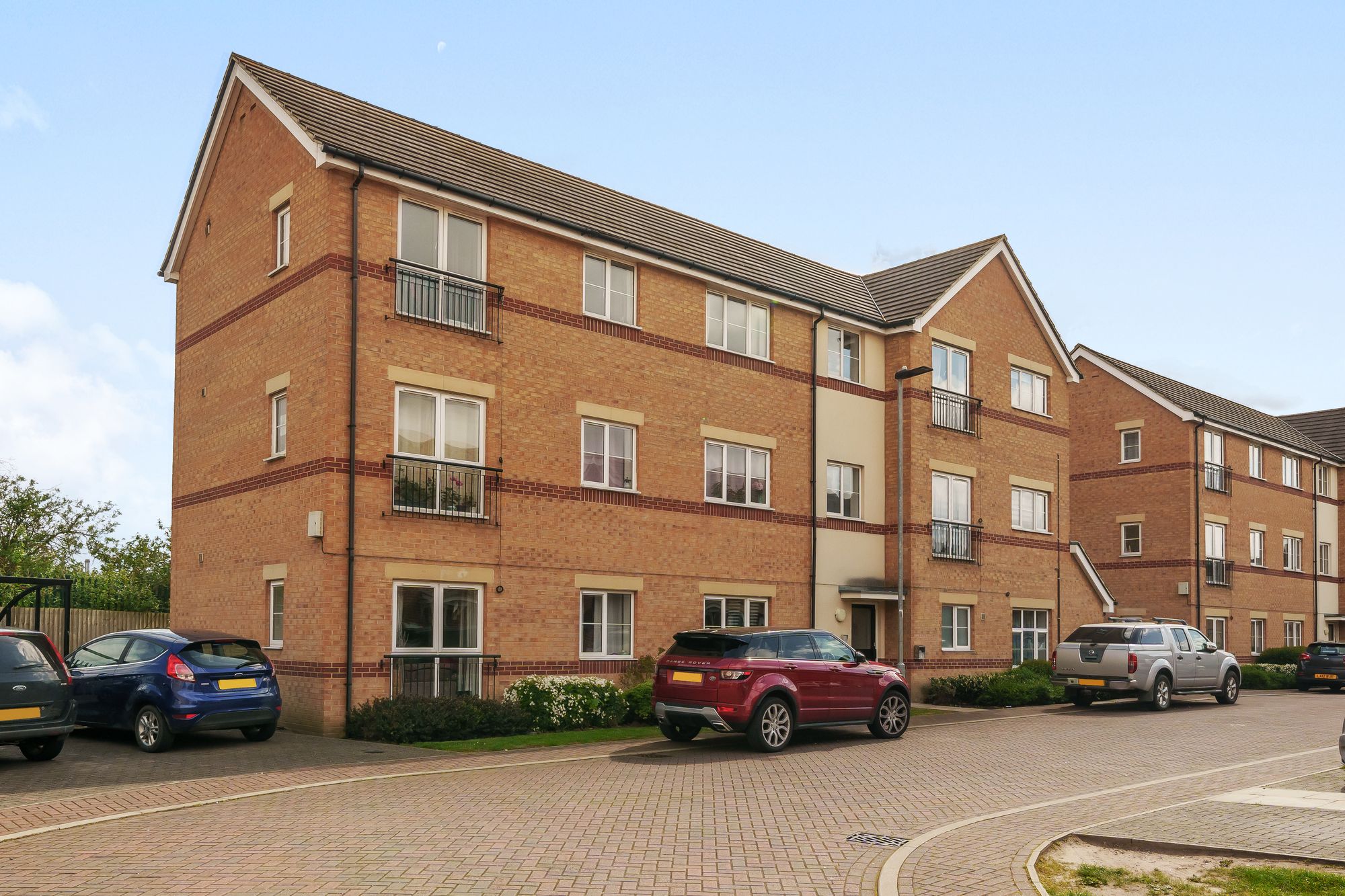 A Rathbone Crescent apartment block in buff brick with red brick banding